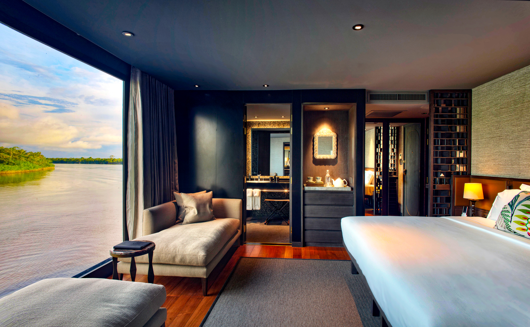 A guest suite with views of the Amazon onboard the Aqua Nera river cruiser in Peru