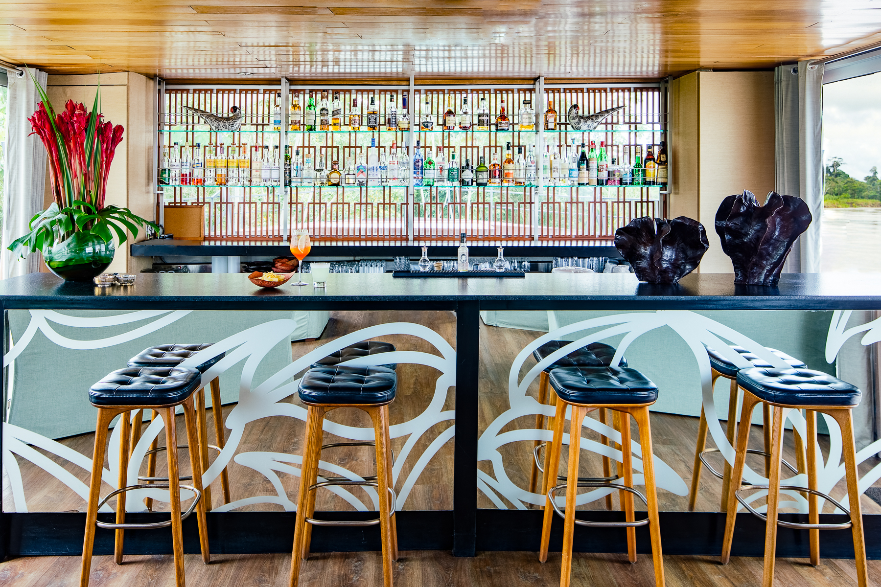 Close up view of the bar onboard the Aria Amazon luxury river cruiser in Peru
