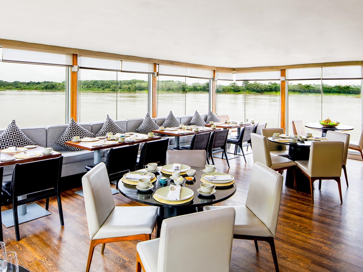 Dining tables onboard the Aria Amazon luxury river cruiser in Peru