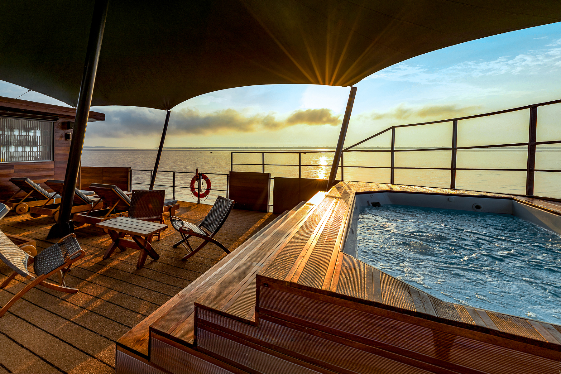 Jacuzzi in the outdoor lounge onboard the Aria Amazon luxury river cruiser in Peru