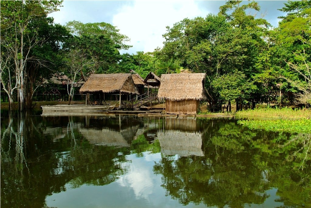 Village viewed onboard Delfin 1 in Peru
