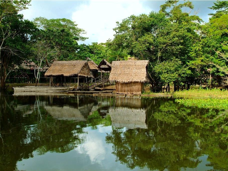 Village viewed onboard Delfin 1 in Peru
