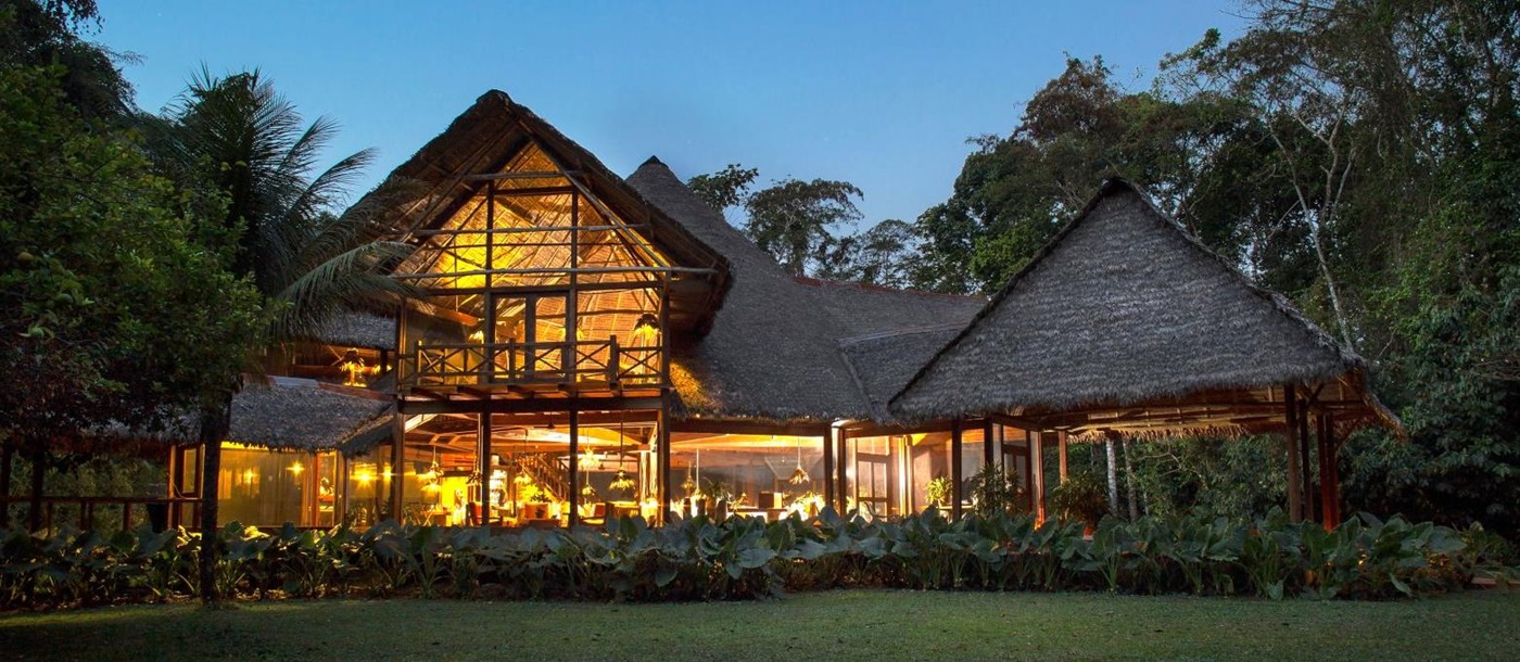 Exterior view of the main lodge building at Inkaterra Reserva Amazonica in Peru
