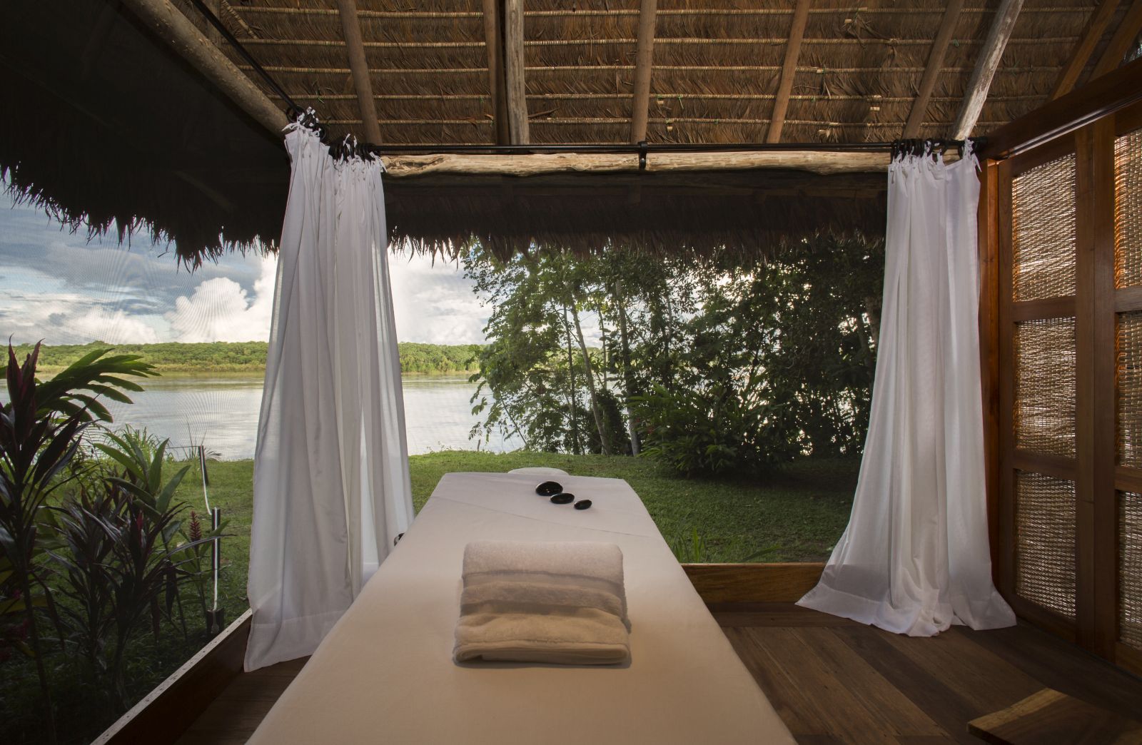 Massage table overlooking the river at Inkaterra Reserva Amazonica's spa in Peru
