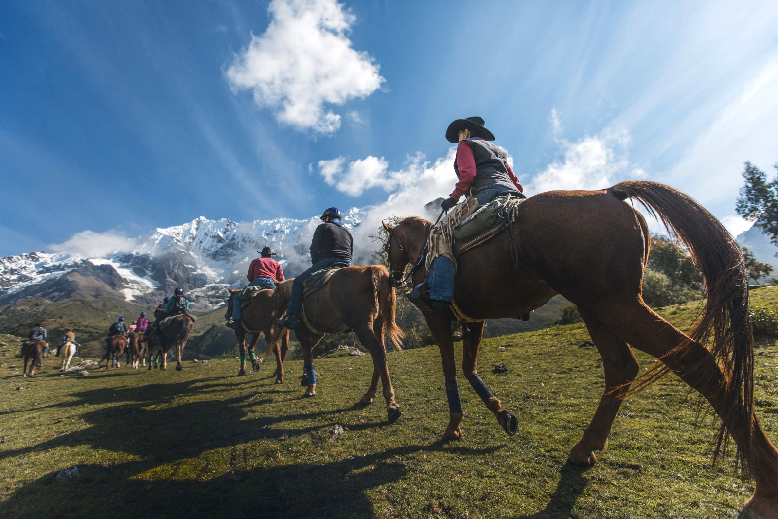 People riding up a hill