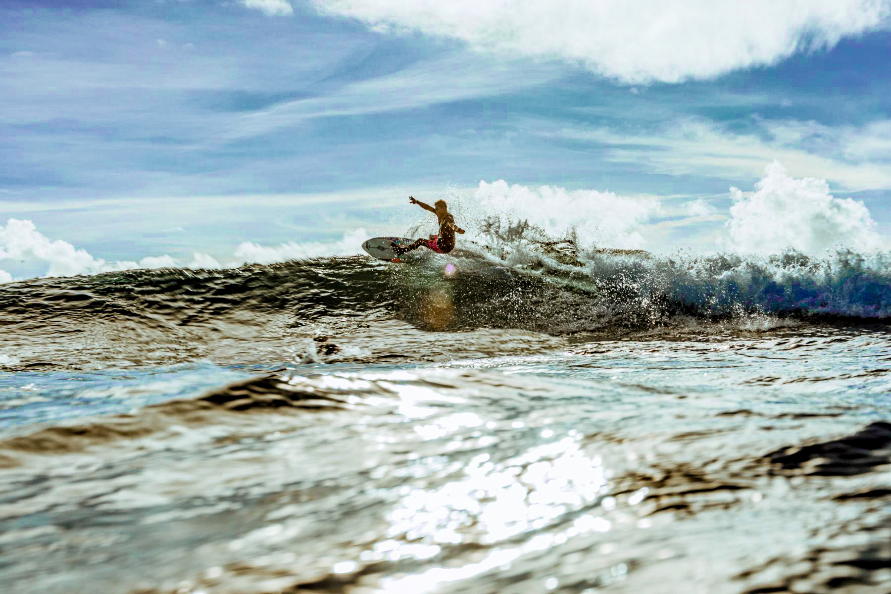 Surfing at Nay Palad Hideaway beach resort in the Philippines