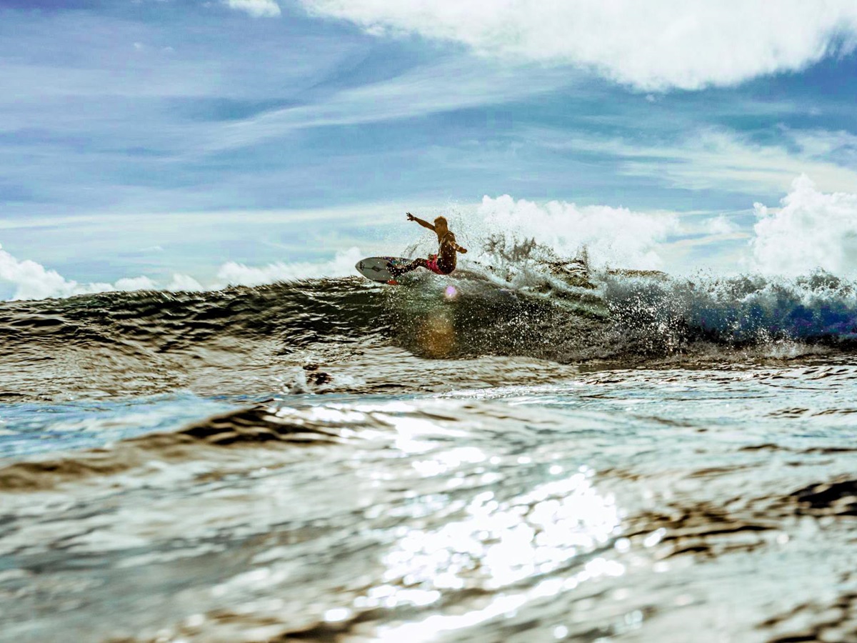 Surfing at Nay Palad Hideaway beach resort in the Philippines