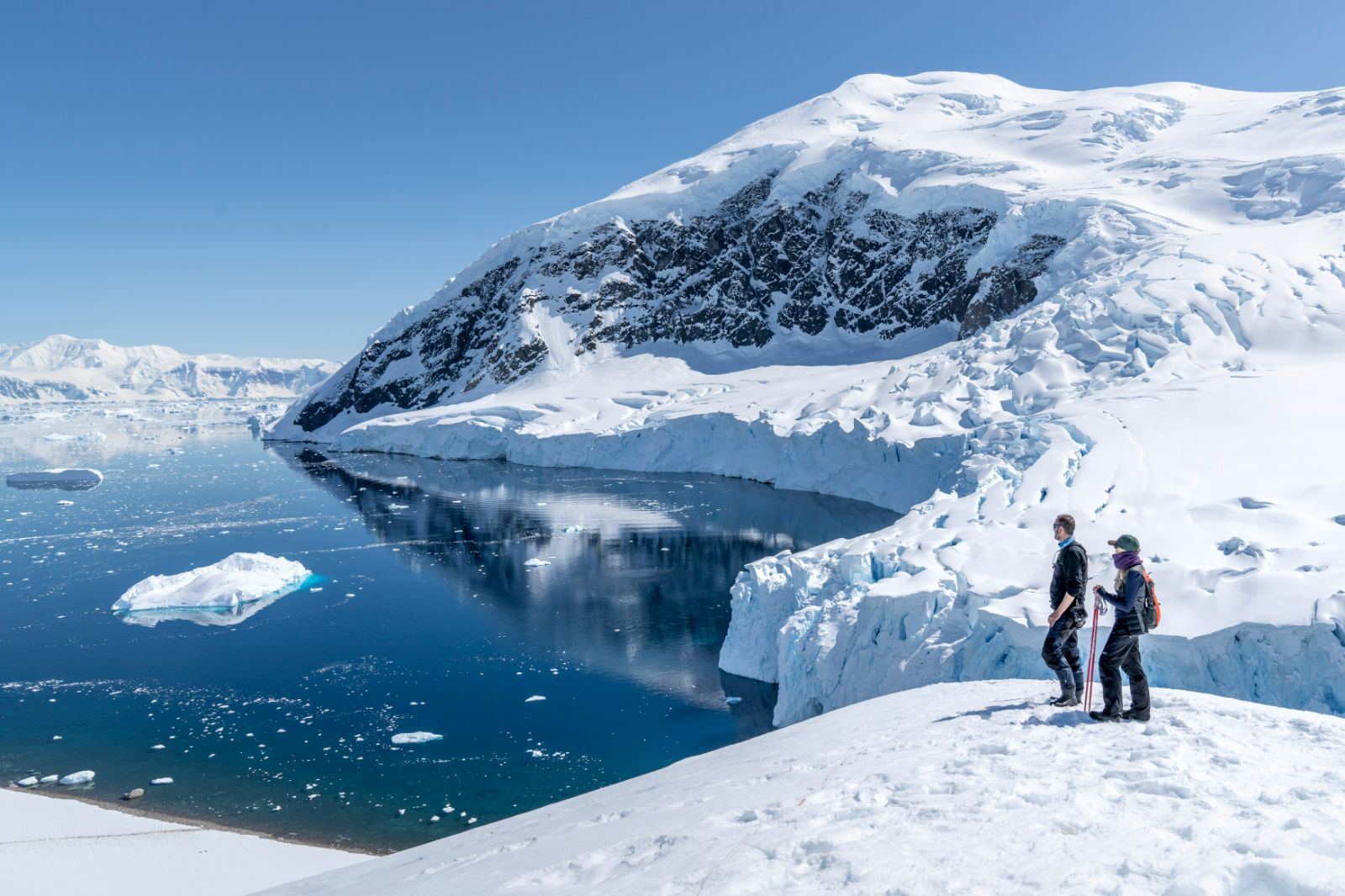 A couple snowshoeing in the Antarctic from the Magellan Explorer