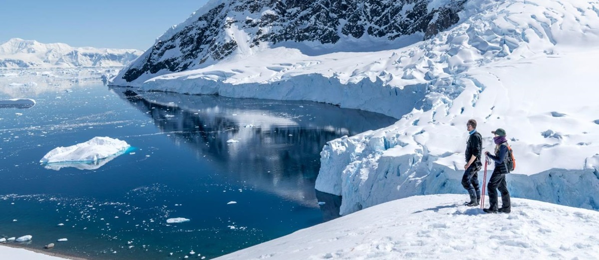 A couple snowshoeing in the Antarctic from the Magellan Explorer