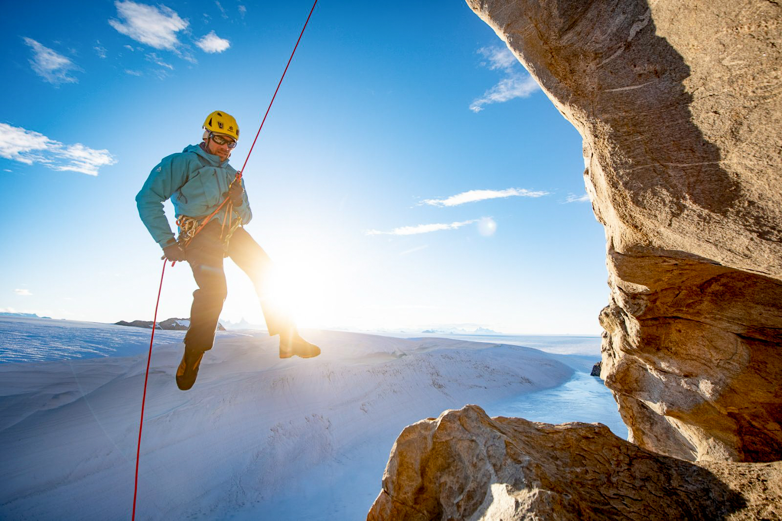 A man abseiling near Echo camp by White Desert in Antarctica