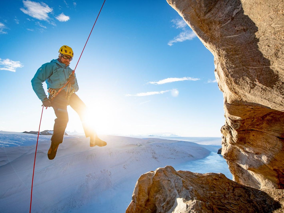 A man abseiling near Echo camp by White Desert in Antarctica
