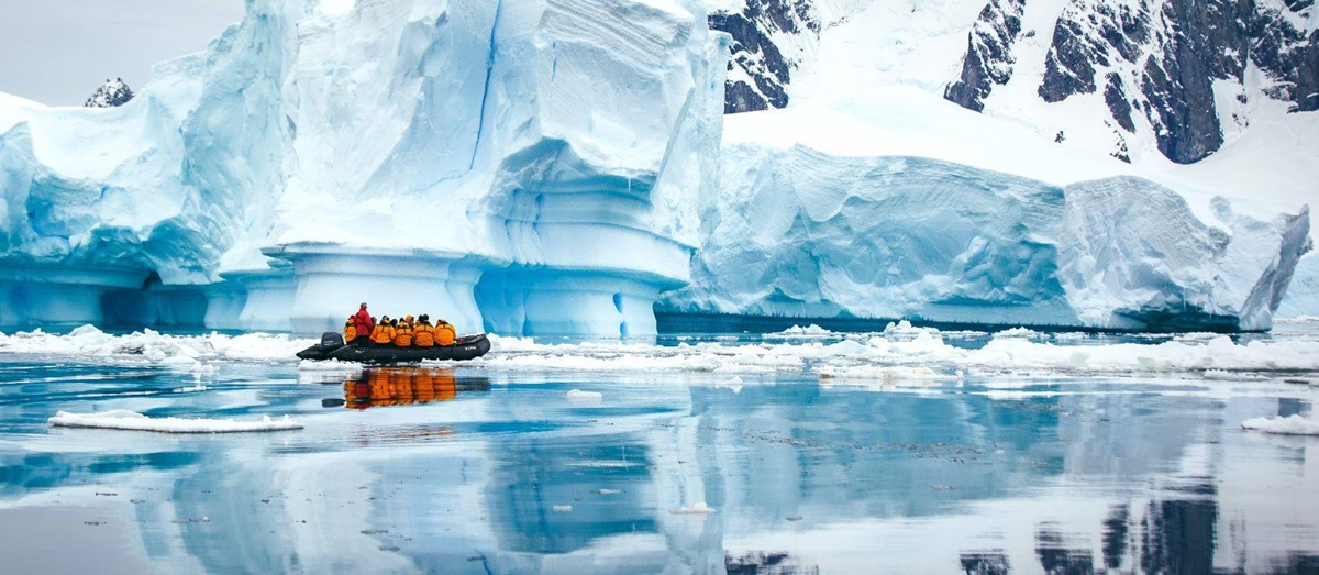 A Zodiac cruising through the Antarctic