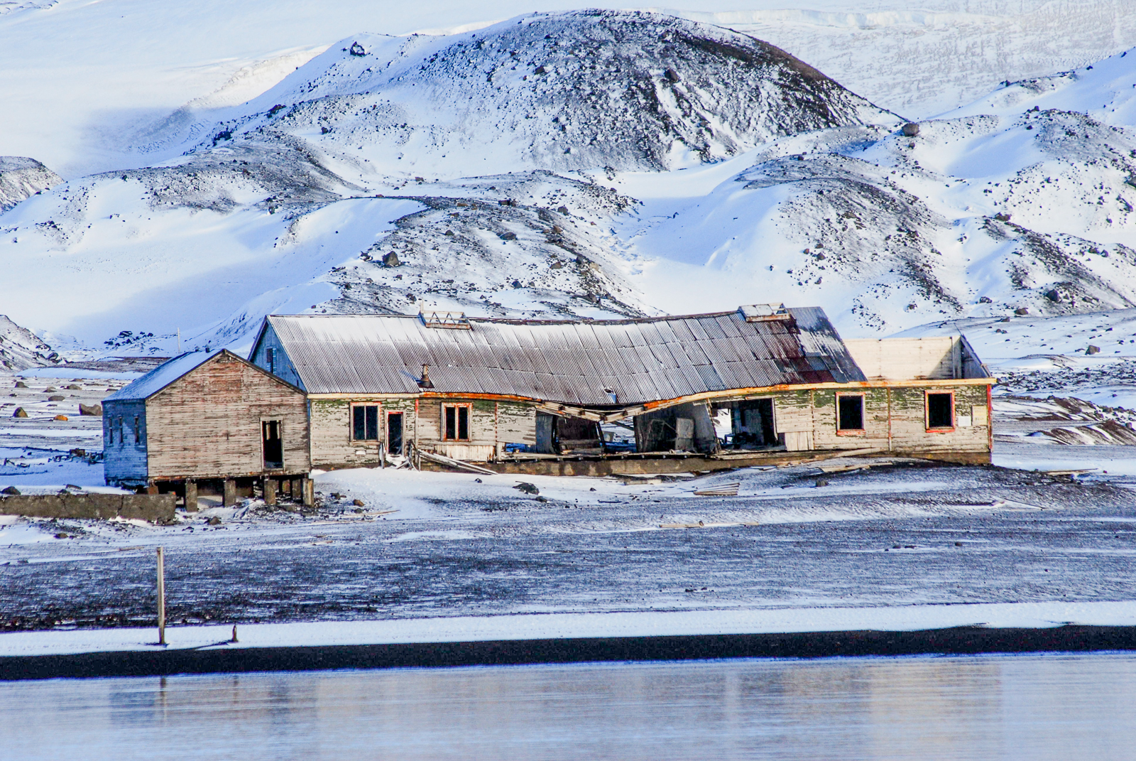 Old whaling buildings on Deception Island in Antarctica
