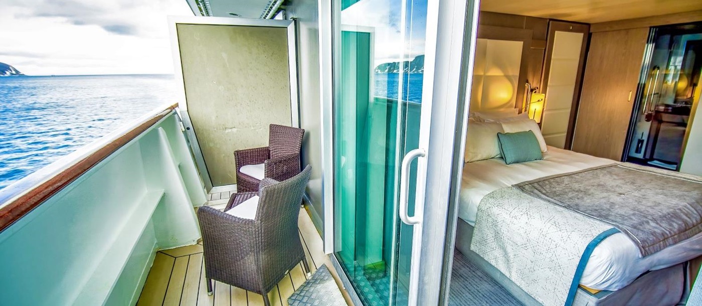Guest suite with balcony onboard Ponant's Le Boreal cruise ship in the Arctic