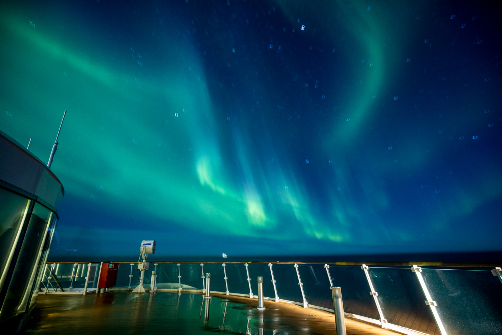 The Northern Lights viewed from the deck of Aurora Expeditions' Sylvia Earle expedition cruise ship in the Arctic