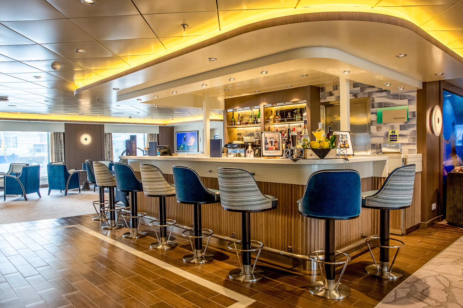 Lounge and bar onboard Aurora Expeditions' Sylvia Earle expedition cruise ship in the Arctic