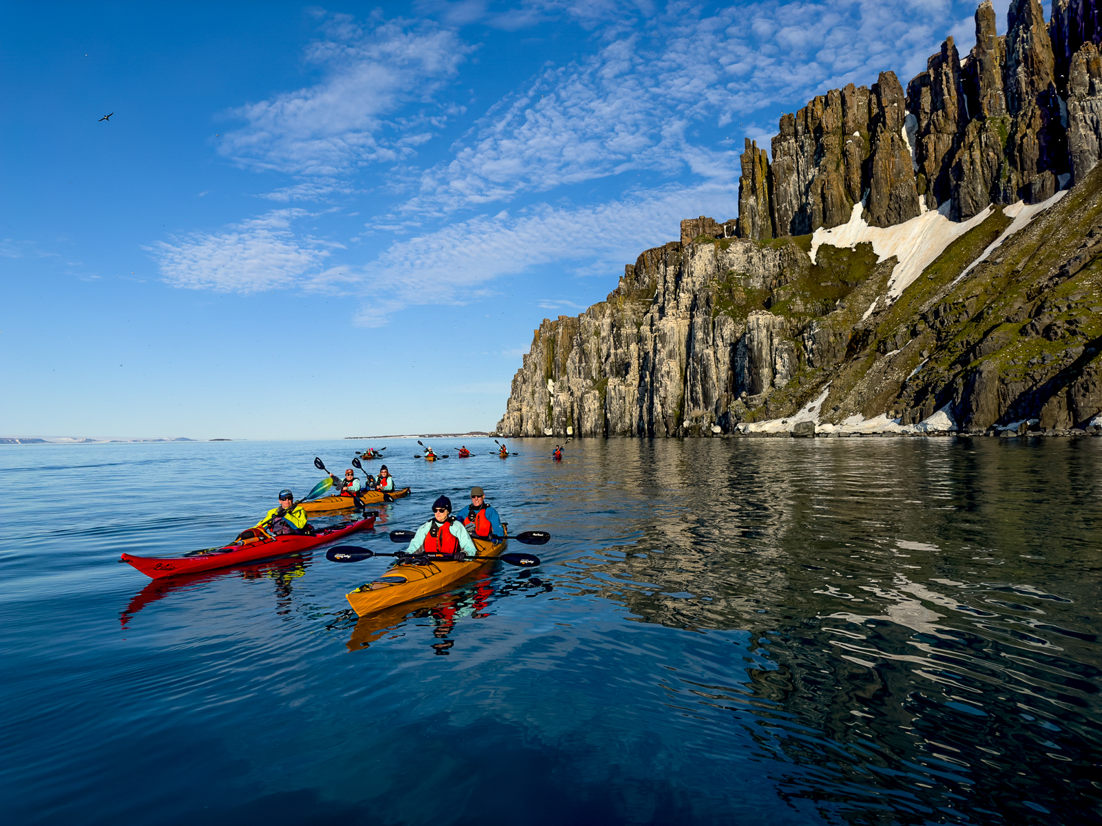 Guests of Aurora Expeditions' Sylvia Earle expedition cruise ship kayaking in the Arctic
