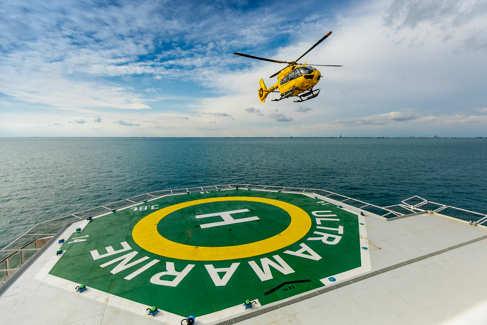 A twin engine helicopter on Quark Expeditions' Ultramarine in the Arctic