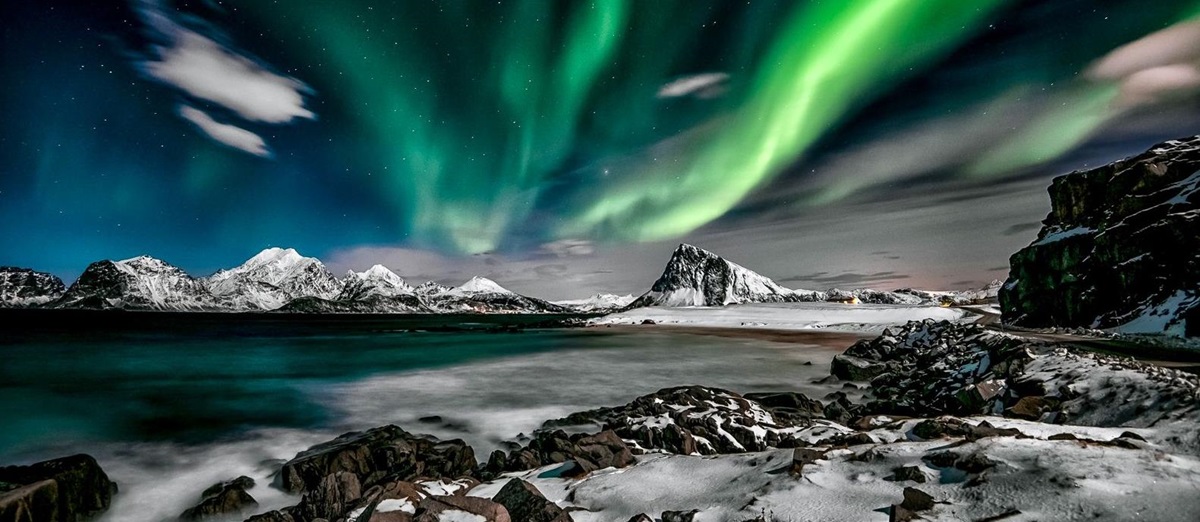 Northern lights over an Arctic landscape
