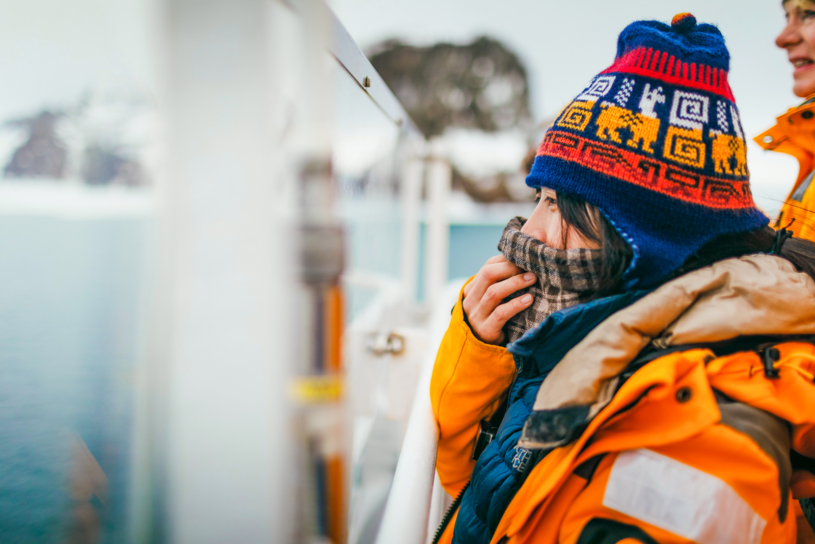 A woman wearing plenty of layers onboard Quark Expeditions' Ultramarine cruise ship in the Arctic