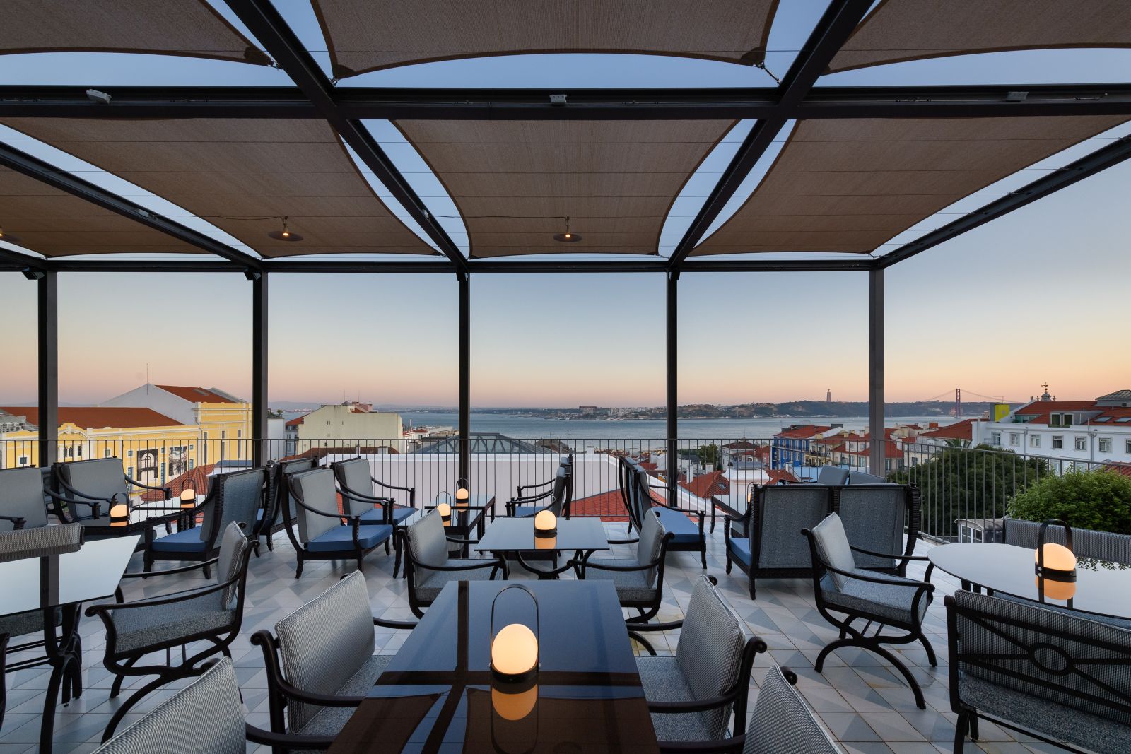 Rooftop terrace of the Bairro Alto Hotel in Lisbon at dusk