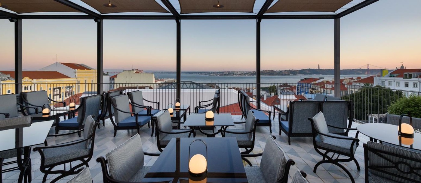 Rooftop terrace of the Bairro Alto Hotel in Lisbon at dusk