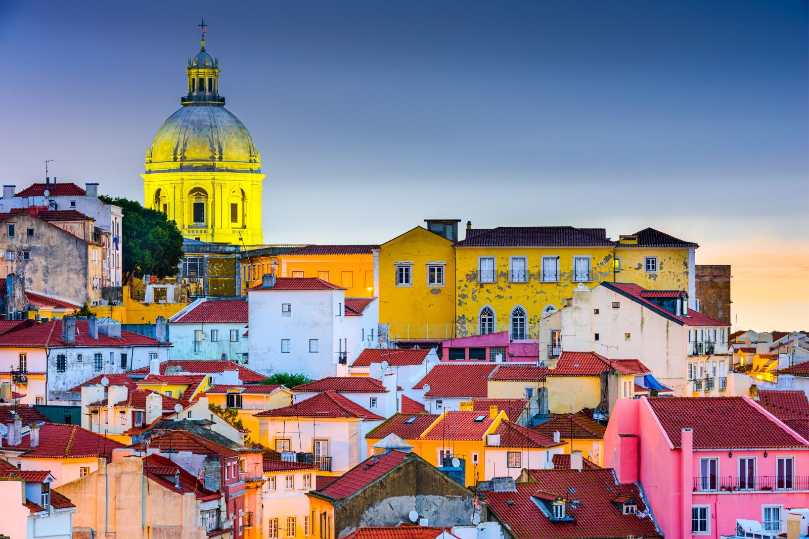 Colourful buildings in Alfama Lisbon illuminated by night