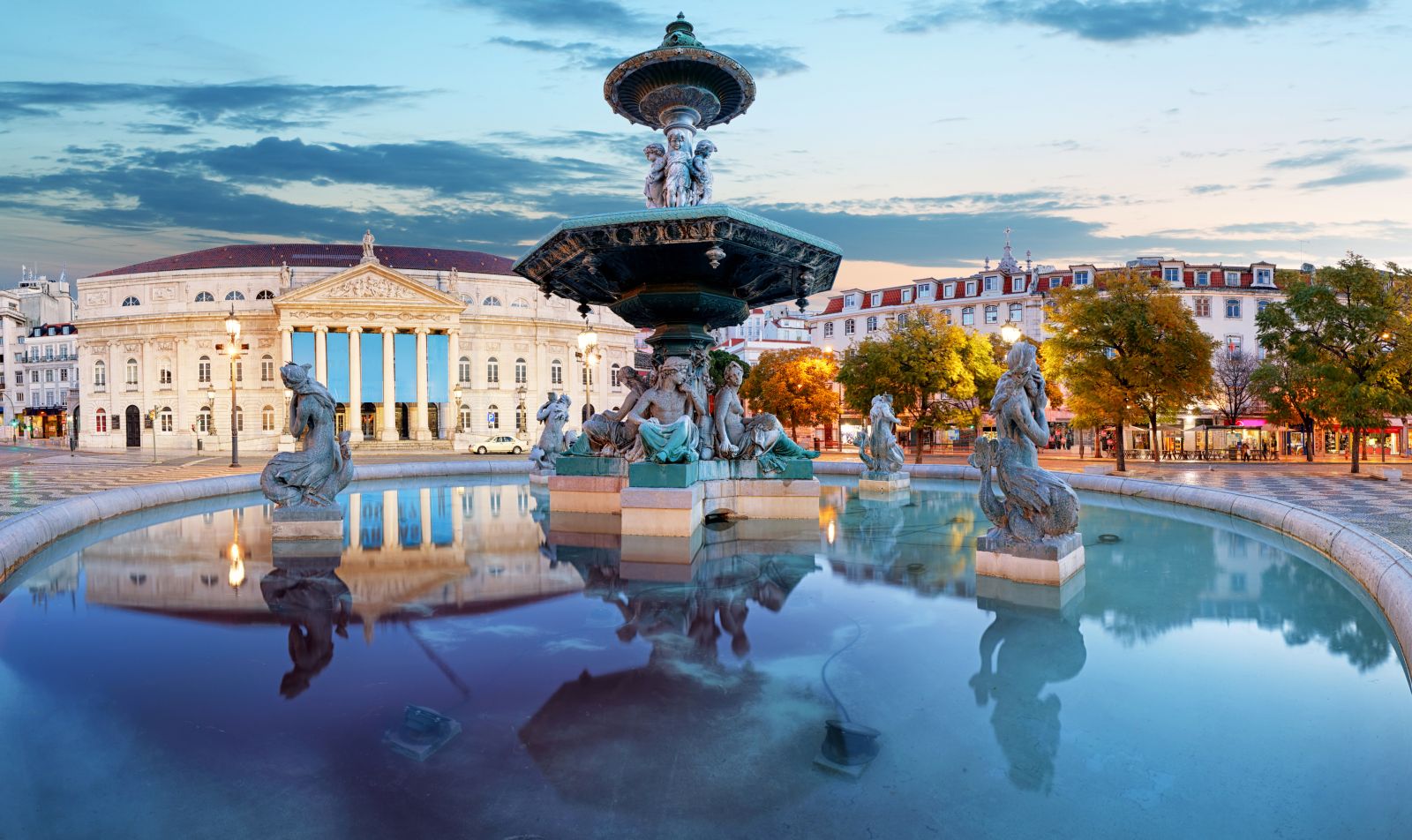 Reflections on a fountain in Rossio Square, Lisbon