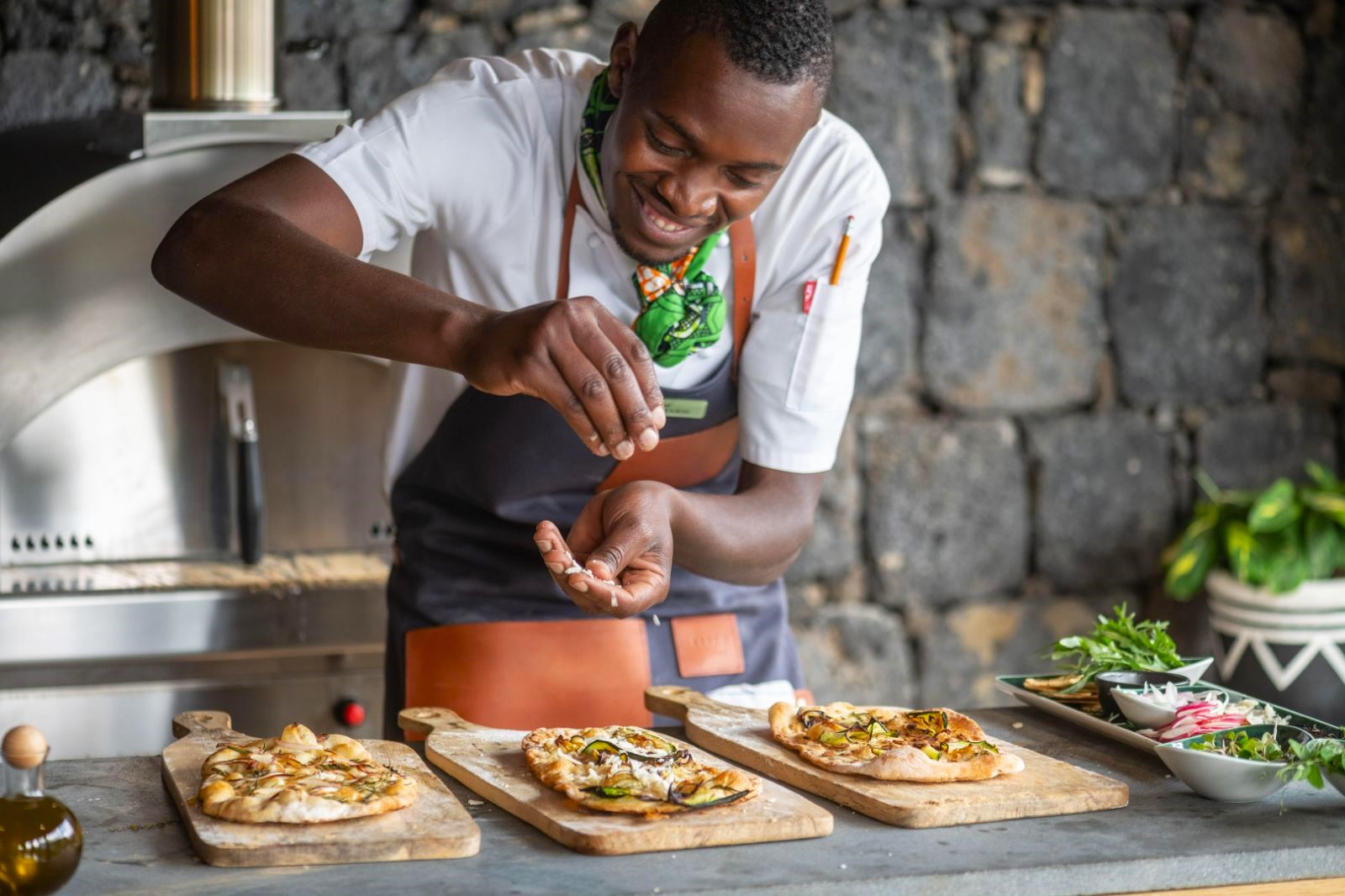 Chef preparing food at Wilderness Bisate Lodge in Rwanda