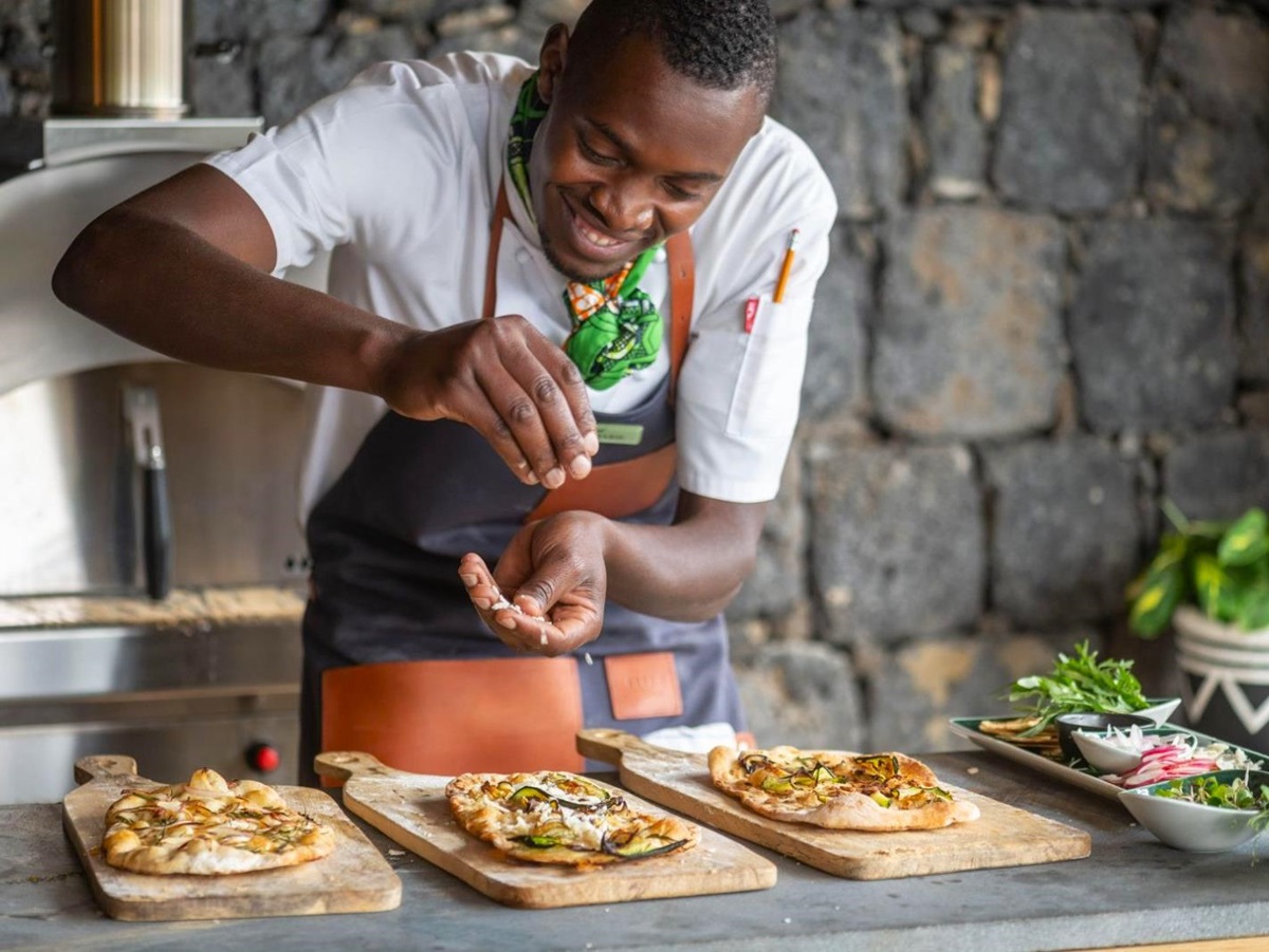 Chef preparing food at Wilderness Bisate Lodge in Rwanda