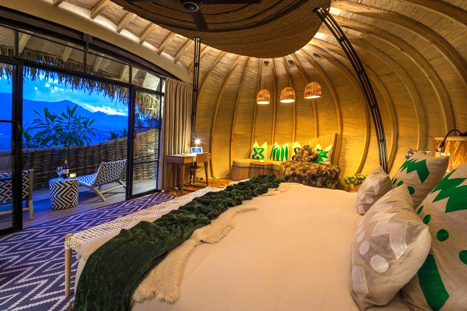 Guest room at dusk at Wilderness Bisate Lodge in Rwanda