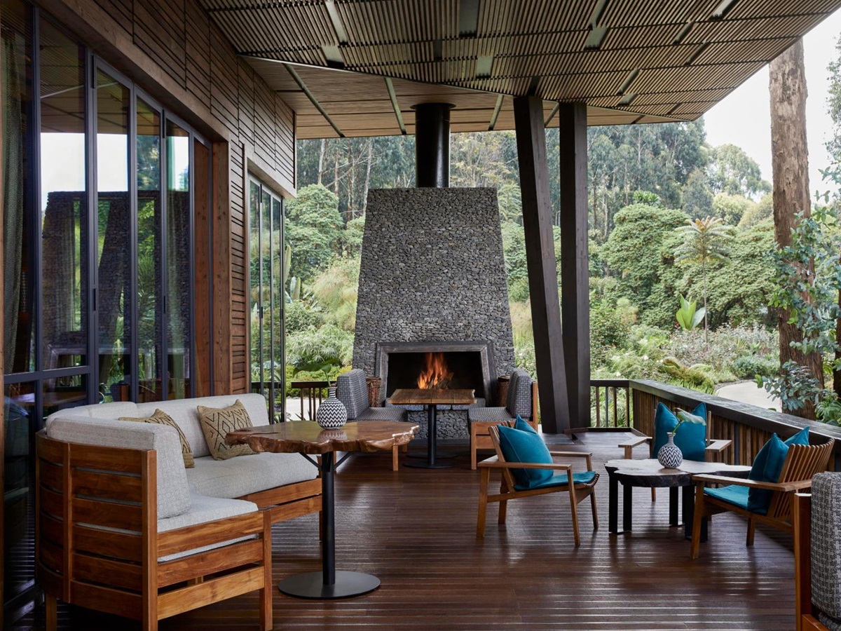 Lounge with fireplace at The Nest bar at One&Only Gorilla's Nest in Rwanda's Volcanoes National Park