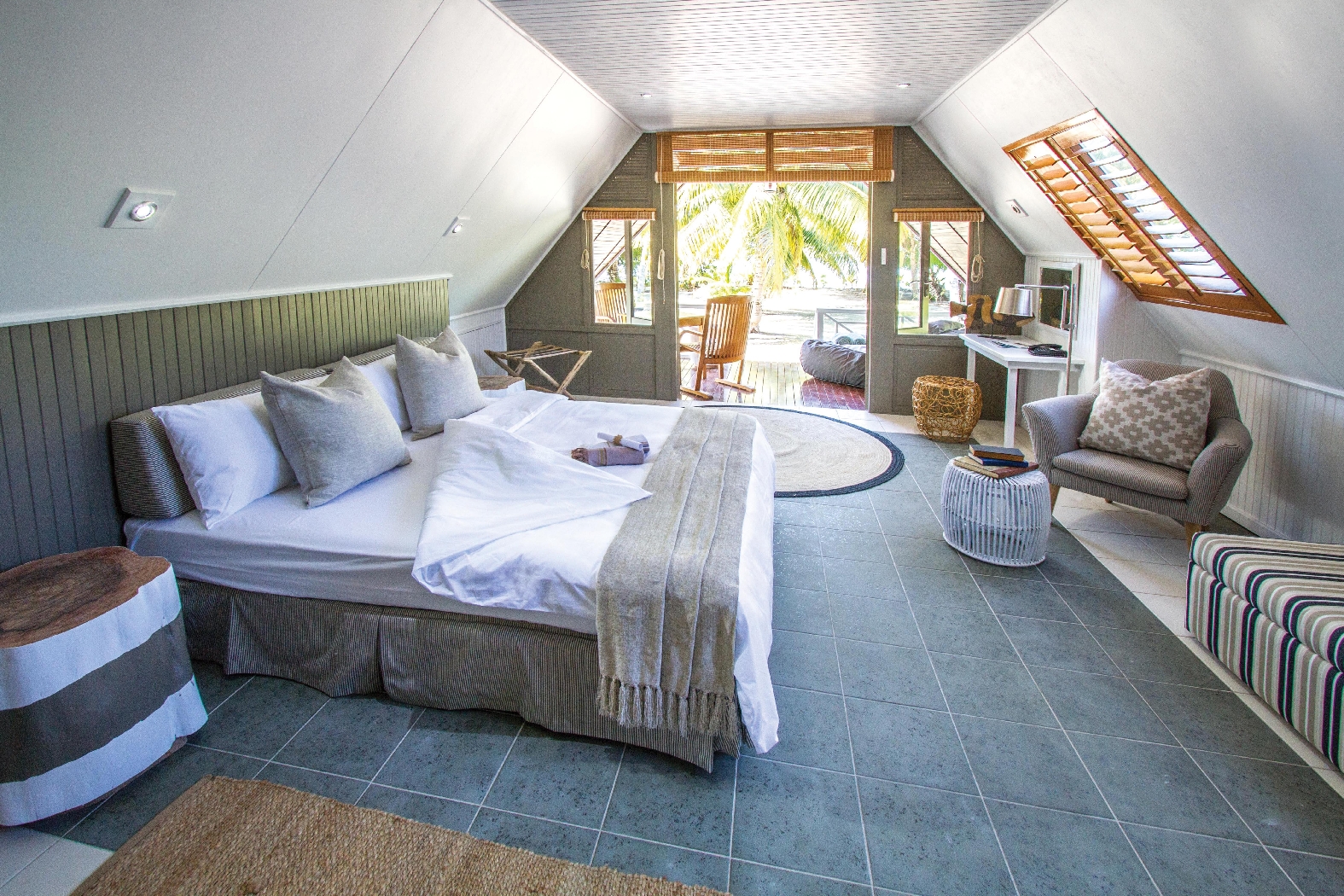 bedroom of a beach bungalow on alphone island, seychelles