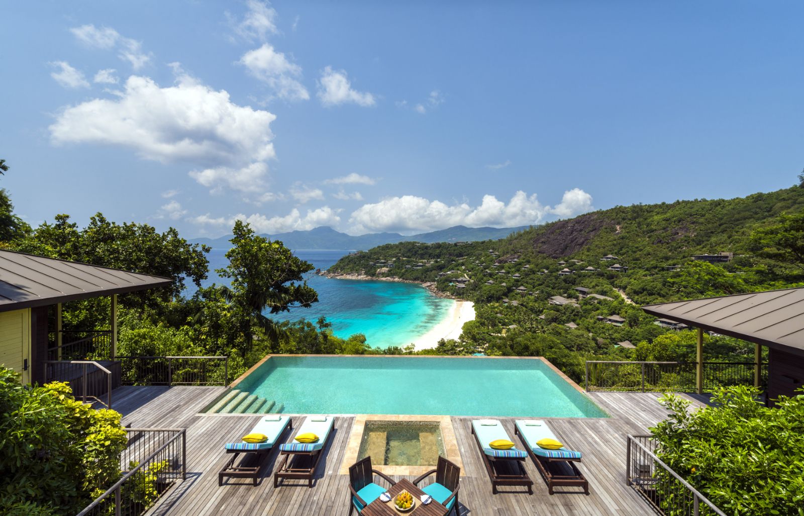 A swimming pool overlooking the ocean at Four Seasons Seychelles