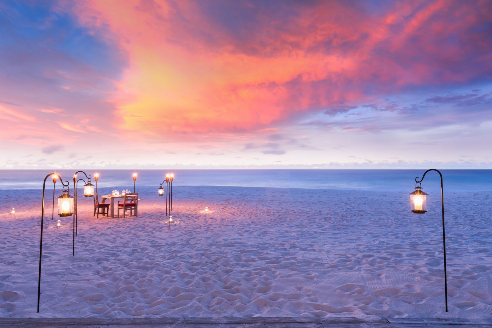 Sunset private beach dining on North Island in the Seychelles