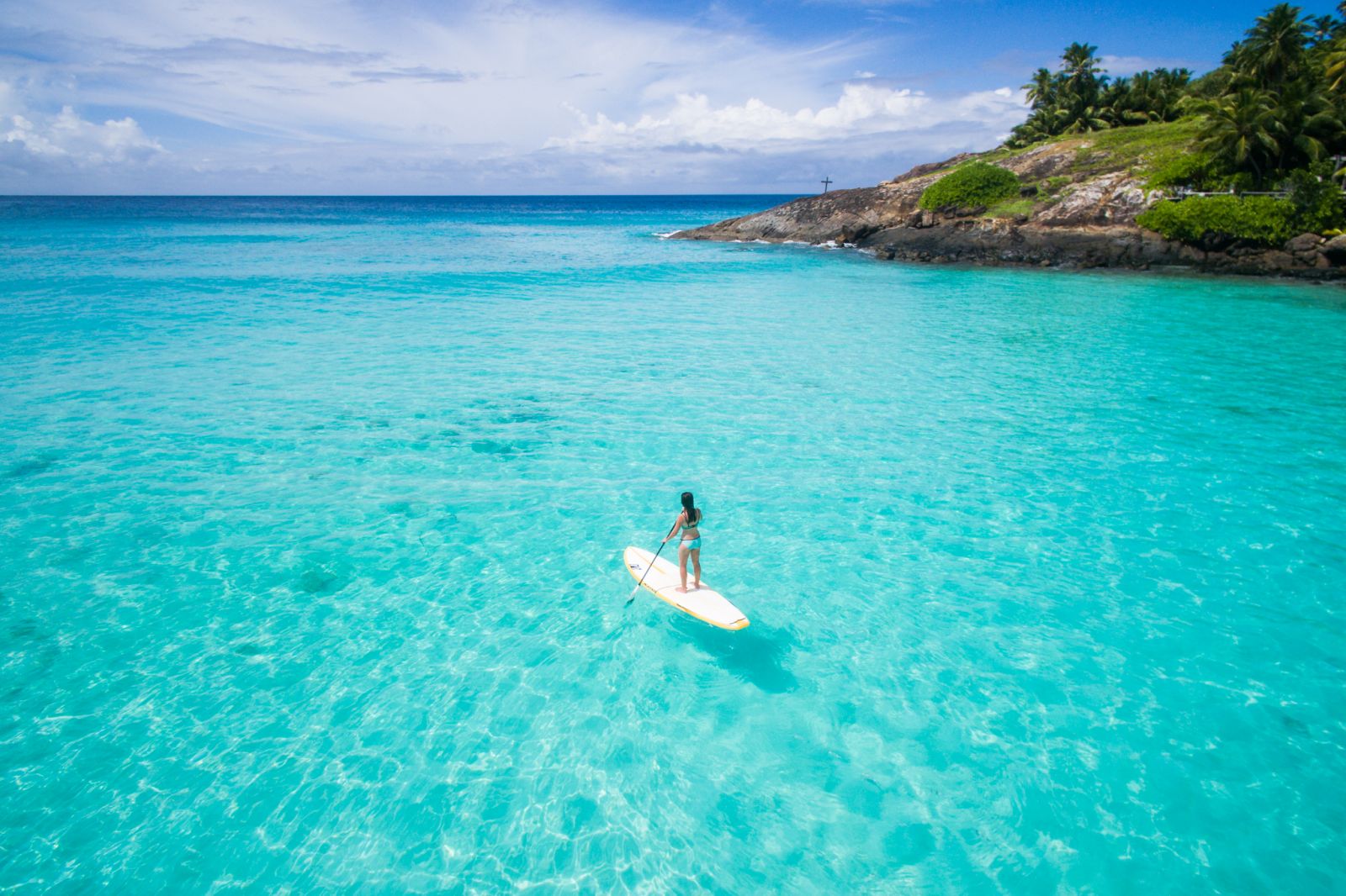 Stand up paddle boarding from North Island in the Seychelles