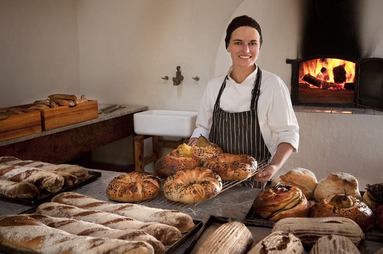 Baker with freshly baked produce at Babylonstoren in South Africa