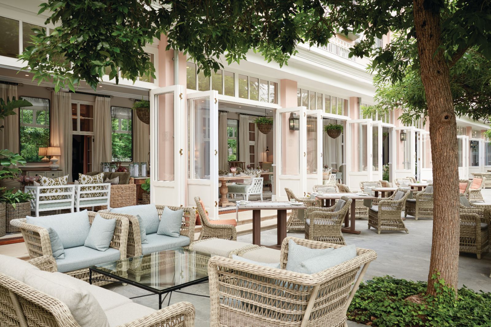 Lounging on the terrace of luxury hotel Belmond The Mount Nelson, overlooking the manicured gardens
