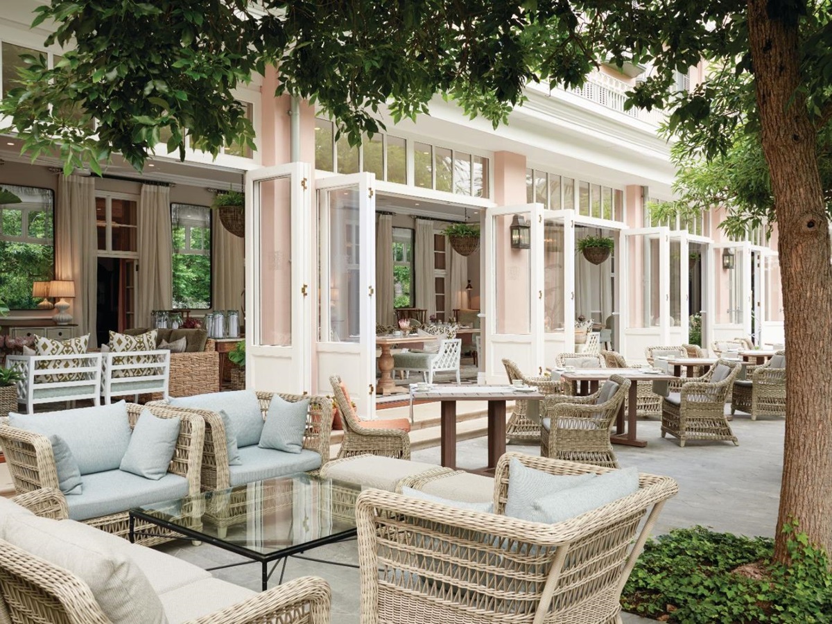 Lounging on the terrace of luxury hotel Belmond The Mount Nelson, overlooking the manicured gardens