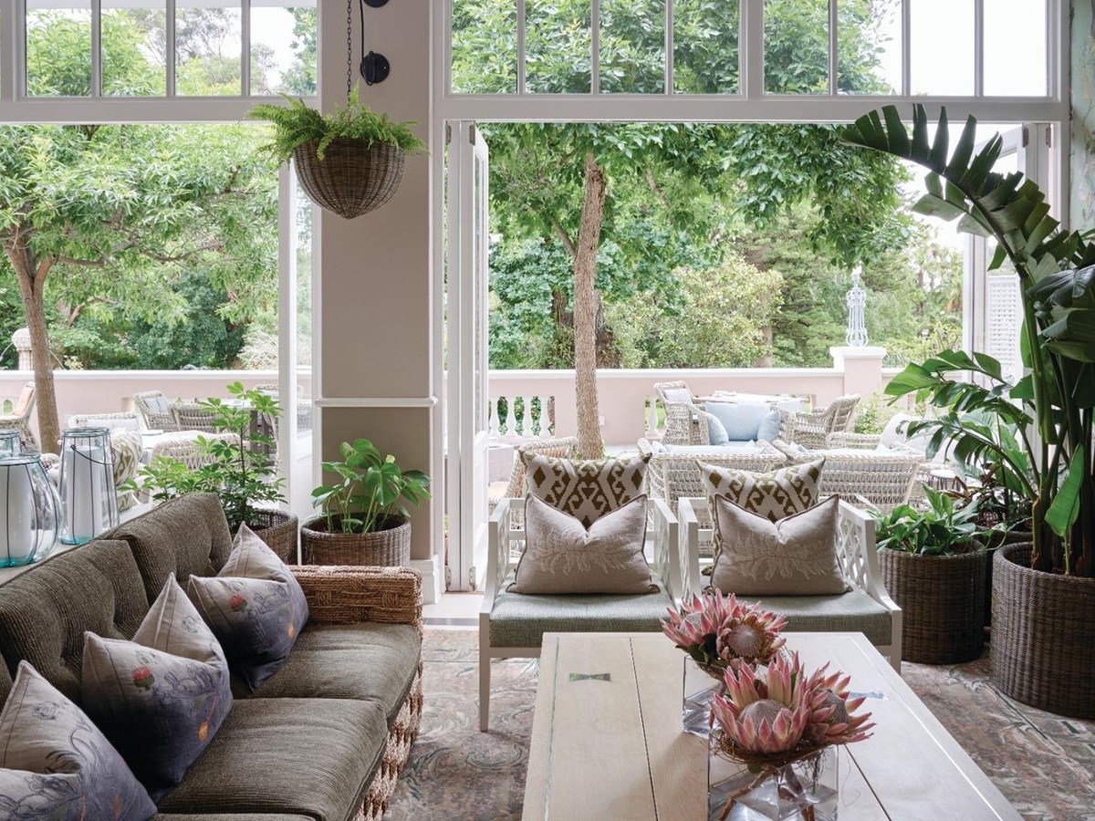 The stylish Lounge at luxury hotel Belmond The Mount Nelson overlooking the gardens