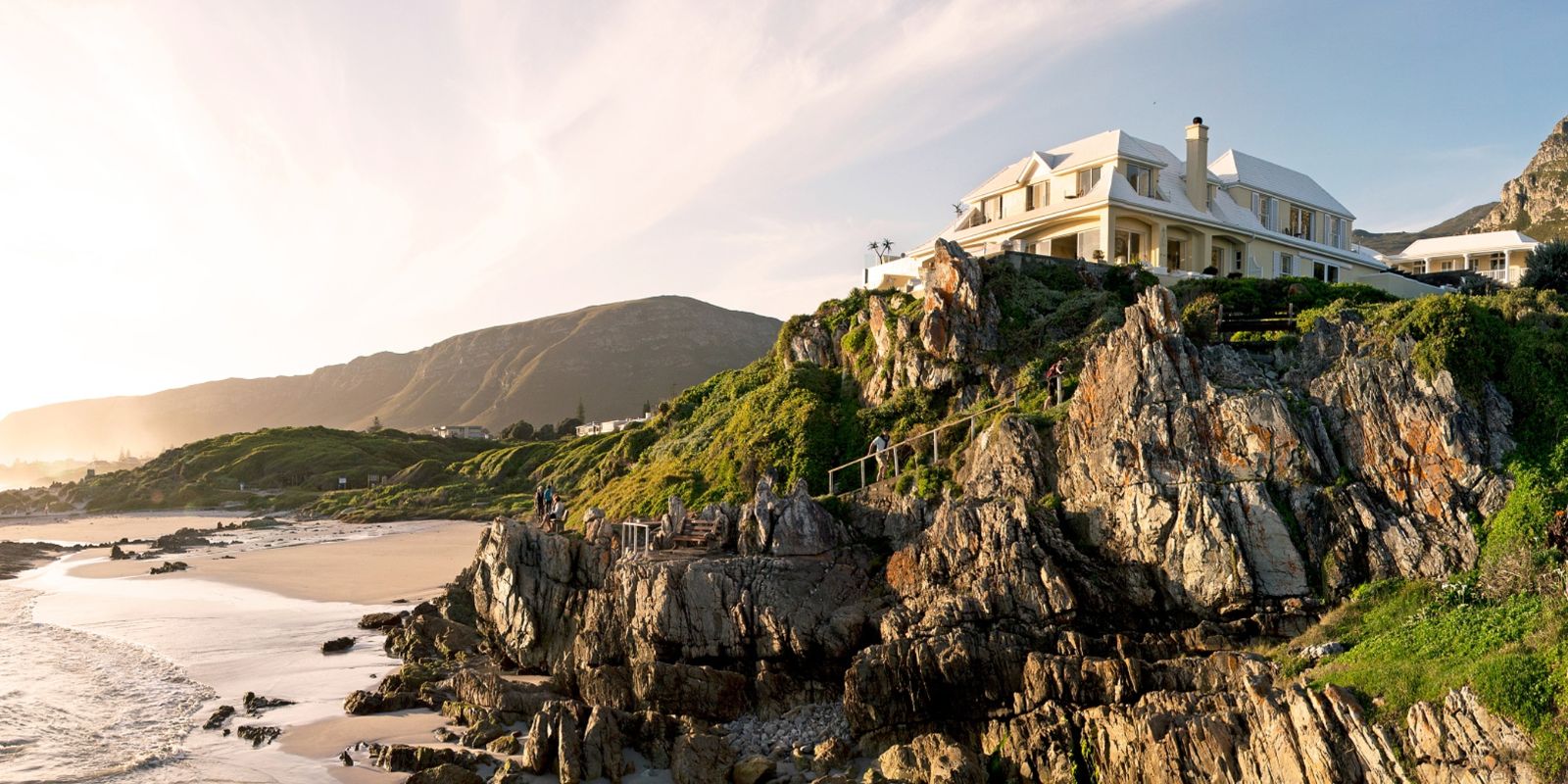 Exterior view from the beach up to luxury hotel Birkenhead House in Hermanus, South Africa