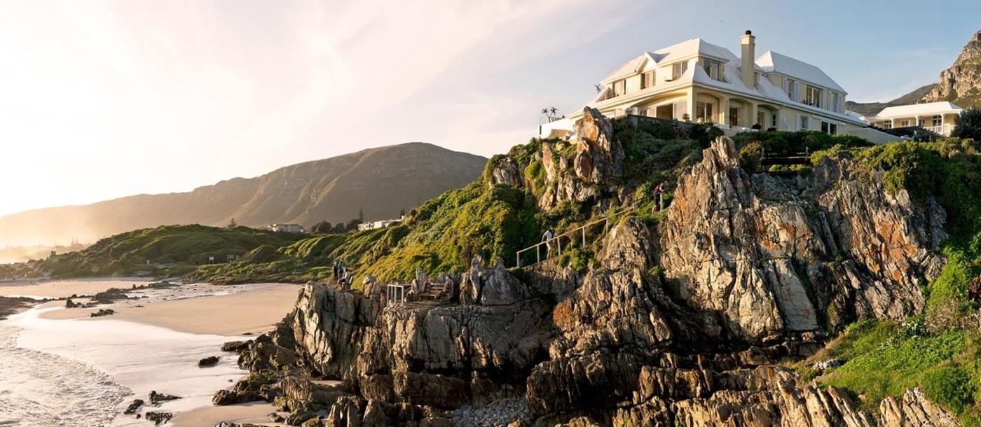 Exterior view from the beach up to luxury hotel Birkenhead House in Hermanus, South Africa