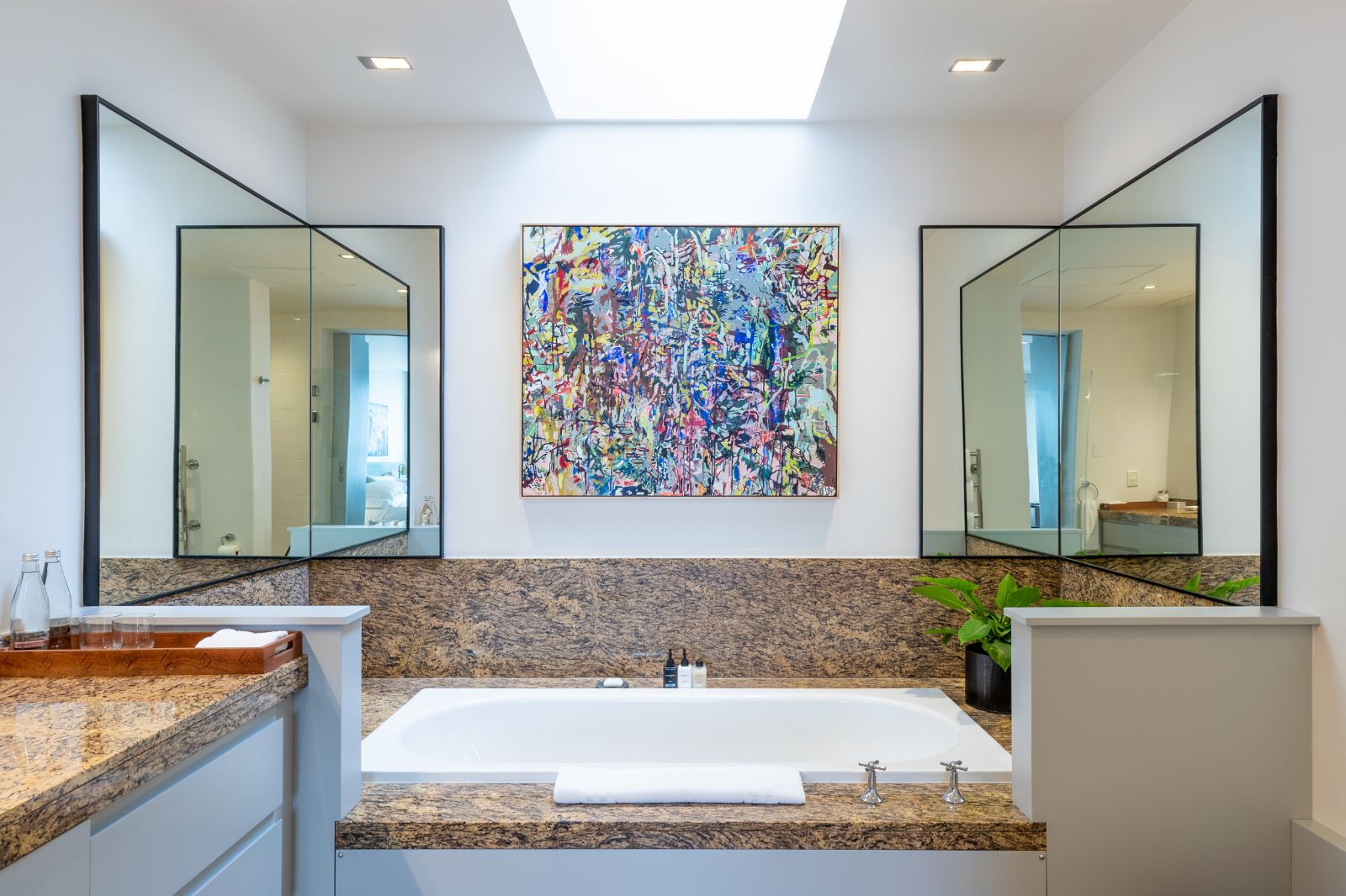 Bathroom with feature painting at luxury hotel Ellerman House in Cape Town