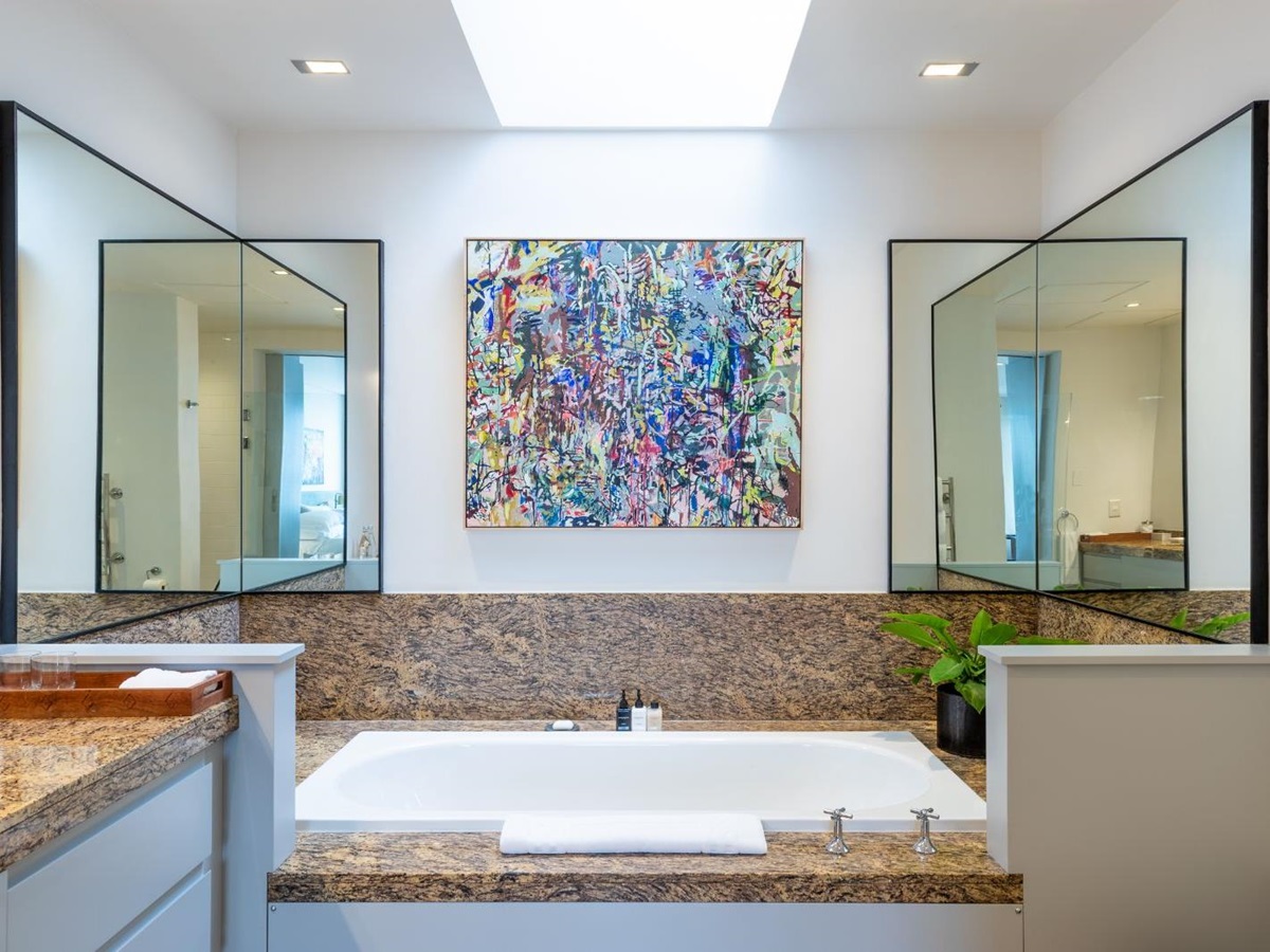 Bathroom with feature painting at luxury hotel Ellerman House in Cape Town
