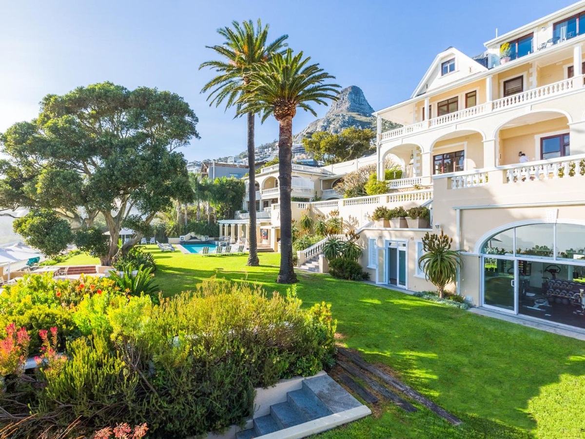 Exterior gardens with lion head statue at luxury hotel Ellerman House in Cape Town South Africa