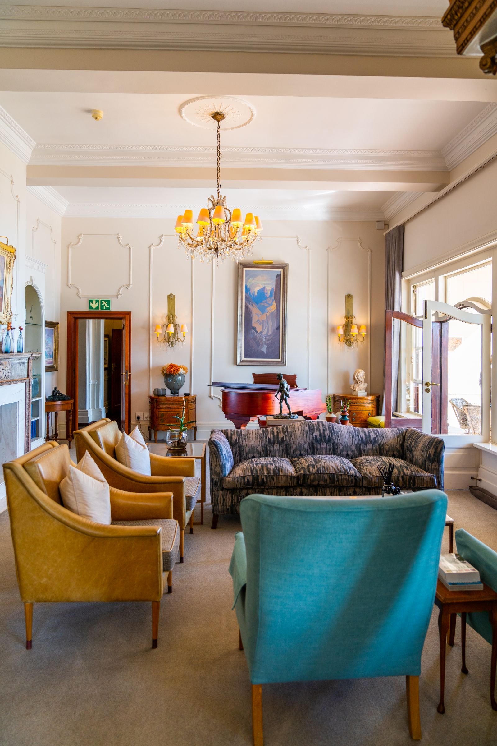 Lounge with a tasteful array of colourful furniture at luxury hotel Ellerman House in Cape Town