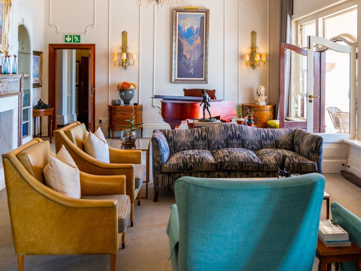 Lounge with a tasteful array of colourful furniture at luxury hotel Ellerman House in Cape Town