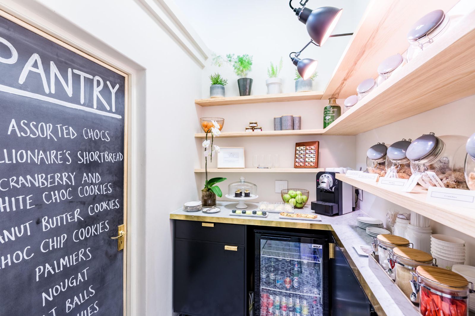 fully stocked pantry with sweet and savoury snacks at luxury hotel Ellerman House in Cape Town South Africa