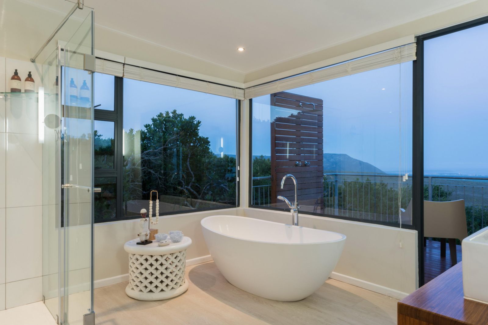 stand alone bath in large bathroom with panoramic views of the coast at luxury lodge Grootbos Garden Lodge in South Africa