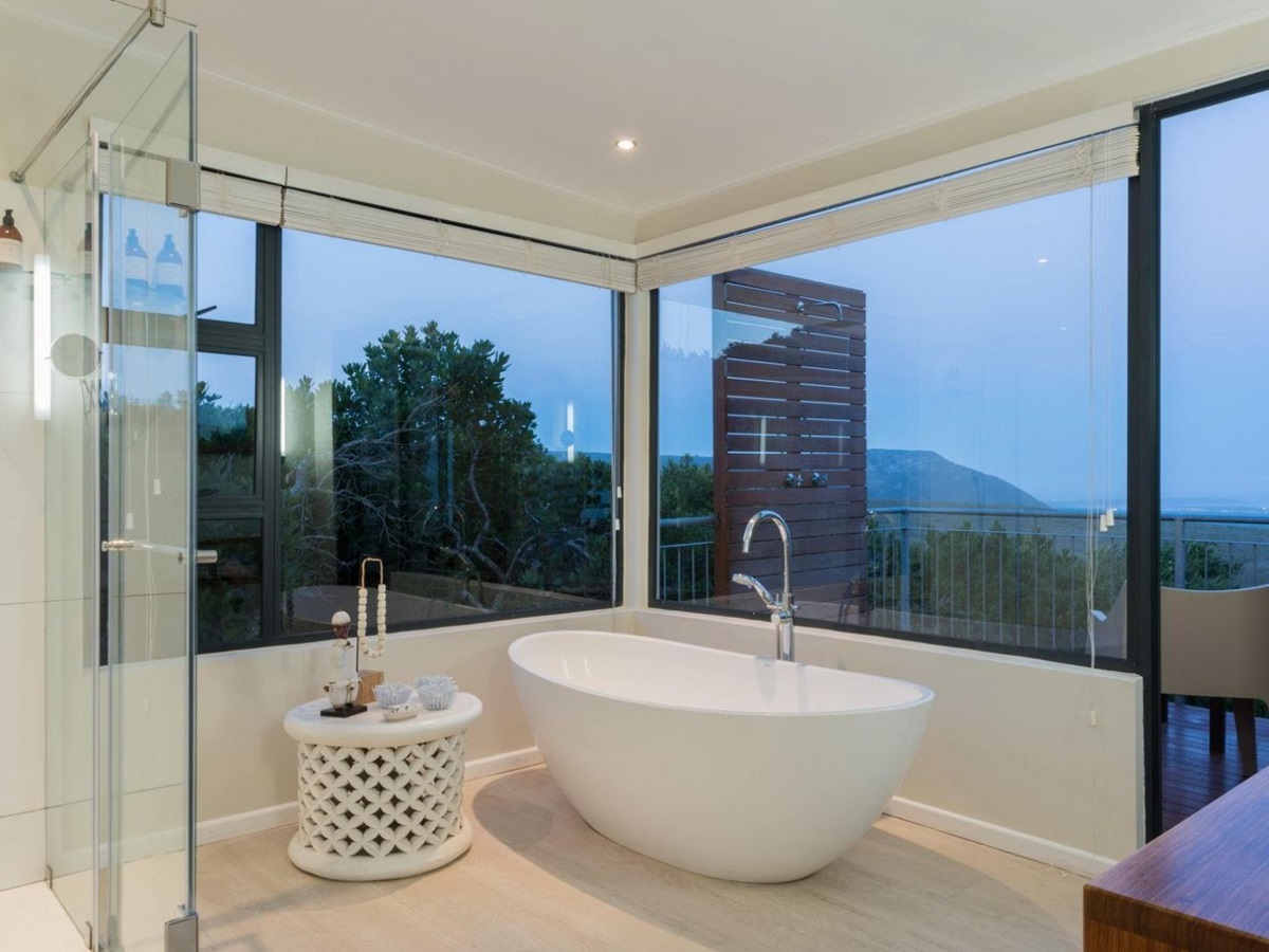 stand alone bath in large bathroom with panoramic views of the coast at luxury lodge Grootbos Garden Lodge in South Africa